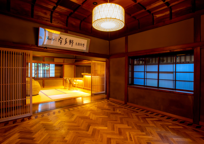 Hotel New Awaji Group Kyoto traditional interior with tatami space and warm lighting, reflecting refined Japanese design and cultural atmosphere