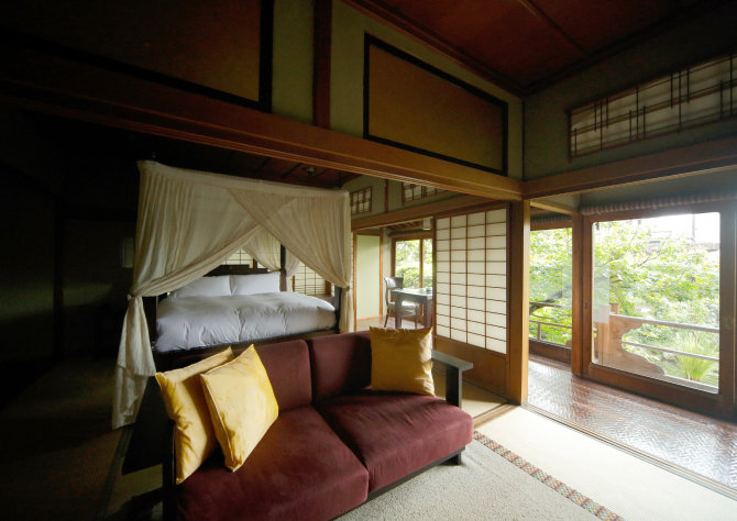 Hotel New Awaji Group Shikoku Okayama guest suite with garden views and natural materials, offering a peaceful and immersive regional stay