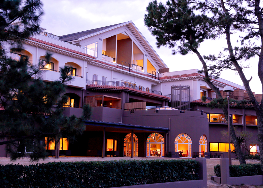 Awaji Hamarikyu traditional ryokan exterior with soft lighting and garden path, offering a refined and peaceful stay experience