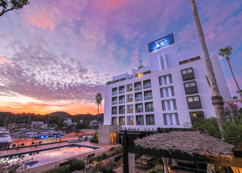 Umi no Hotel Shimahana exterior with harbor views at sunset, providing a relaxed and contemporary coastal stay