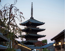 Traditional Kyoto pagoda rising above historic streets, reflecting cultural heritage and timeless atmosphere