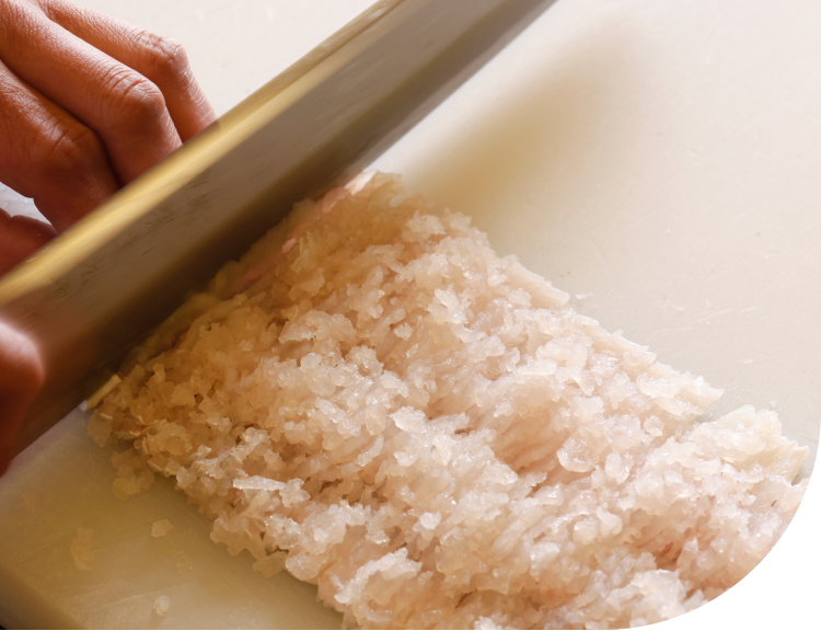 Japanese chef preparing sushi with precision using fresh ingredients on Awaji Island in Japan