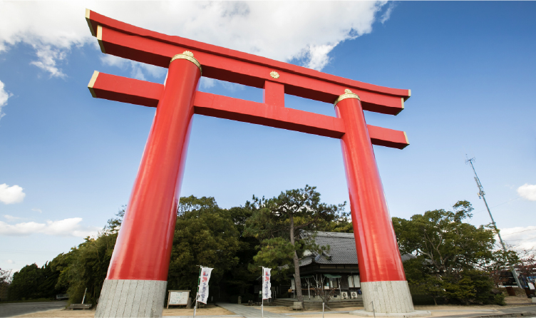Large red torii gate at Onokorojima Shrine on Awaji Island, symbolizing Japan's mythological origins and accessible cultural exploration from nearby resorts