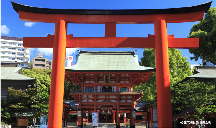 Large red torii gate at Ikuta Shrine in central Kobe, connecting spiritual heritage with nearby lively shopping streets