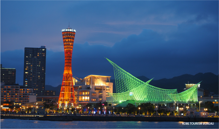 Kobe waterfront skyline with illuminated tower and harbor views, offering a vibrant seaside promenade experience