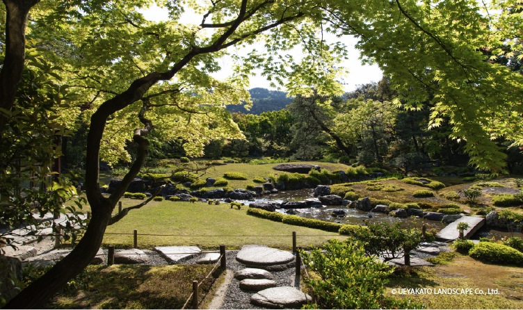 Landscaped garden with stepping stones and greenery in Kyoto, offering a calm and scenic walking experience