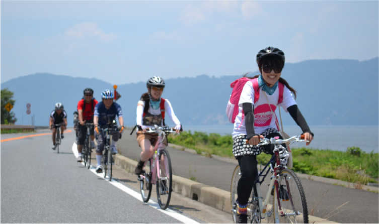 Cyclists riding along Lake Biwa shoreline, offering an active and scenic way to explore Japan's largest lake