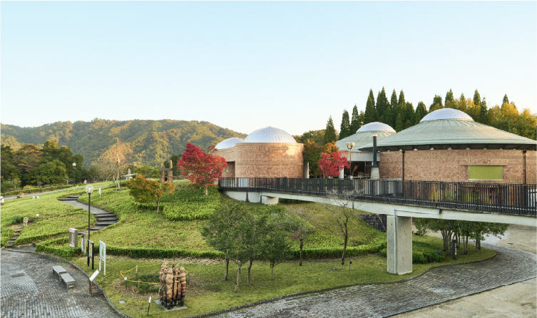 Modern ceramic art complex in Shigaraki with landscaped grounds, highlighting craftsmanship and creative culture near Lake Biwa