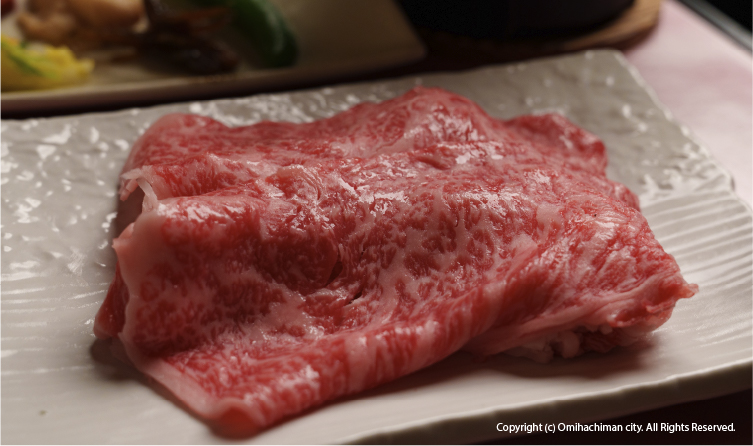 Premium Omi beef served in a refined setting, showcasing one of Japan's oldest wagyu traditions from the Lake Biwa region