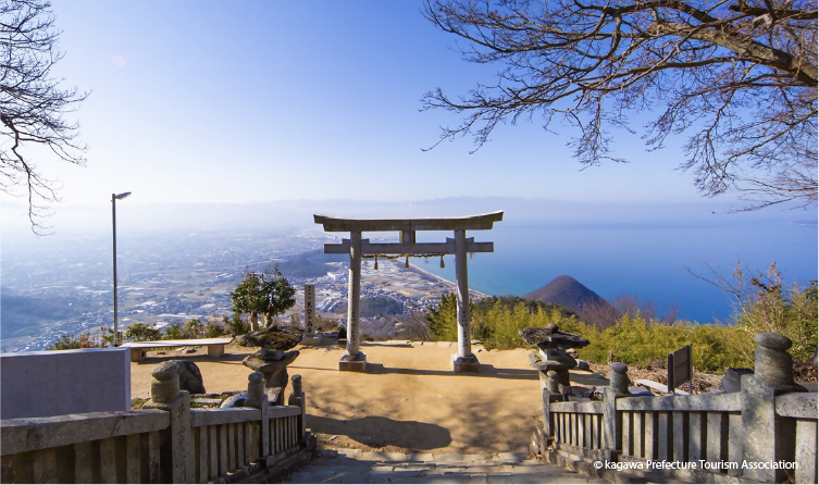 Torii gate overlooking expansive views of the Seto Inland Sea, offering a scenic and spiritual viewpoint in Shikoku