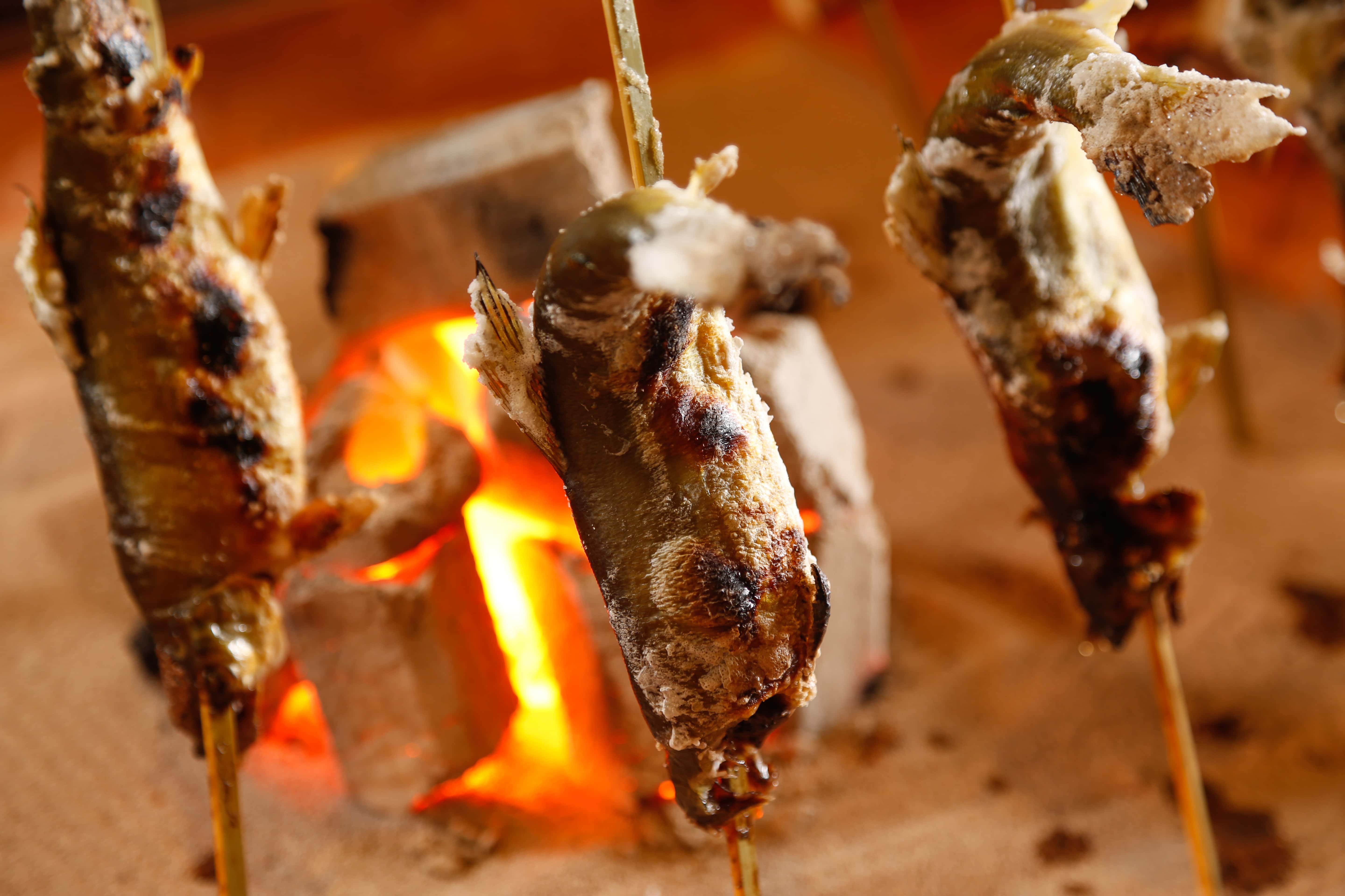Charcoal-grilled whole fish, traditional Japanese seafood cooking highlighting fresh Awaji Island ingredients
