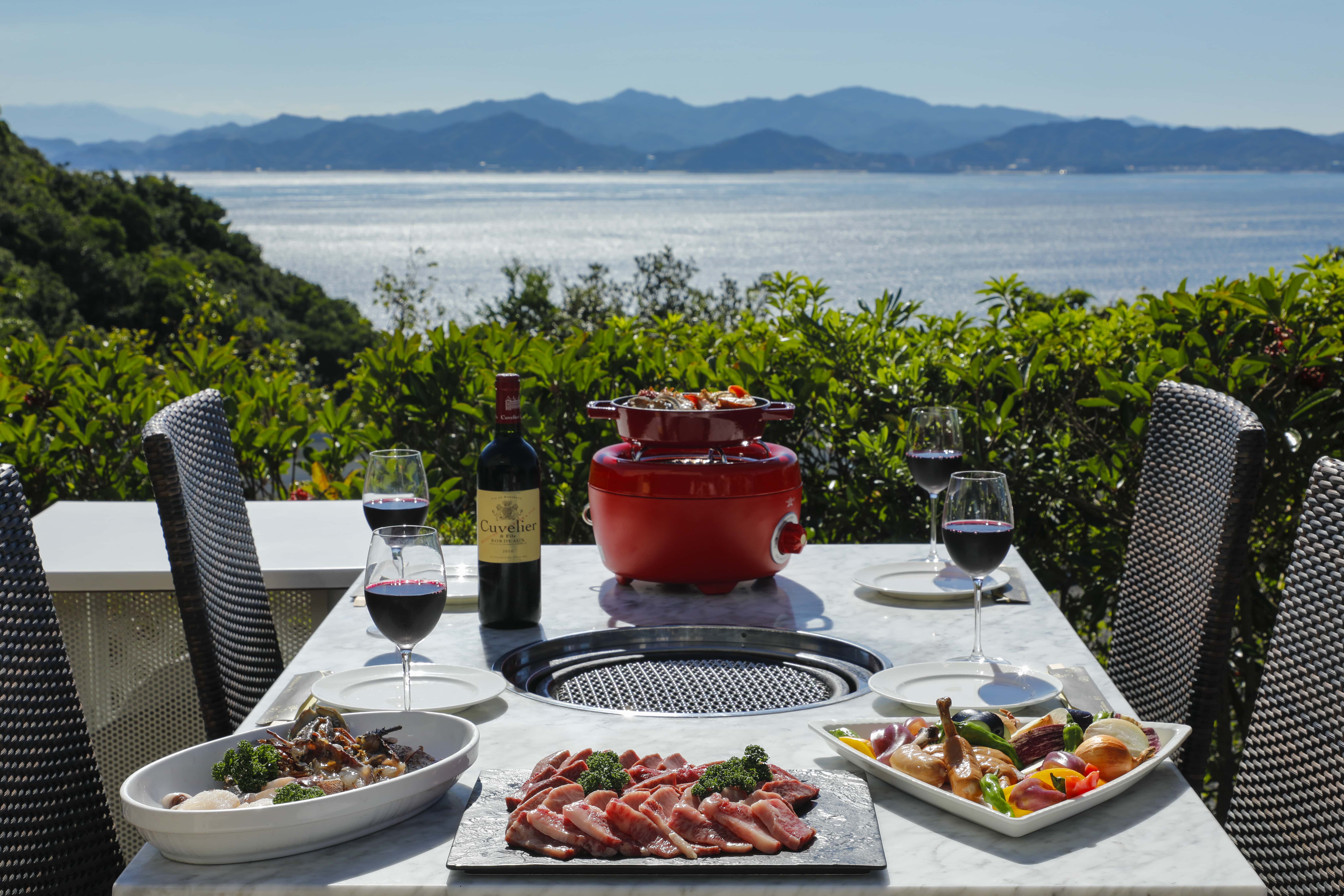 Outdoor dining with ocean view and locally sourced seafood, Awaji Island restaurant experience