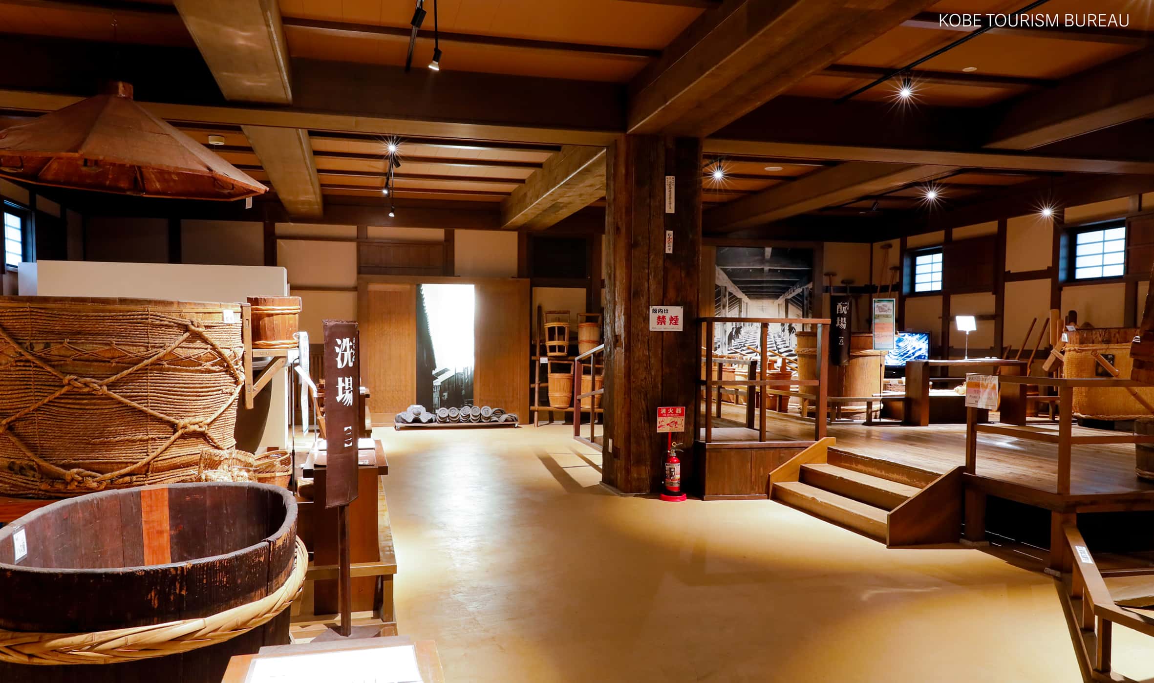 Traditional Japanese brewery interior with wooden barrels, local craft and heritage experience in Japan