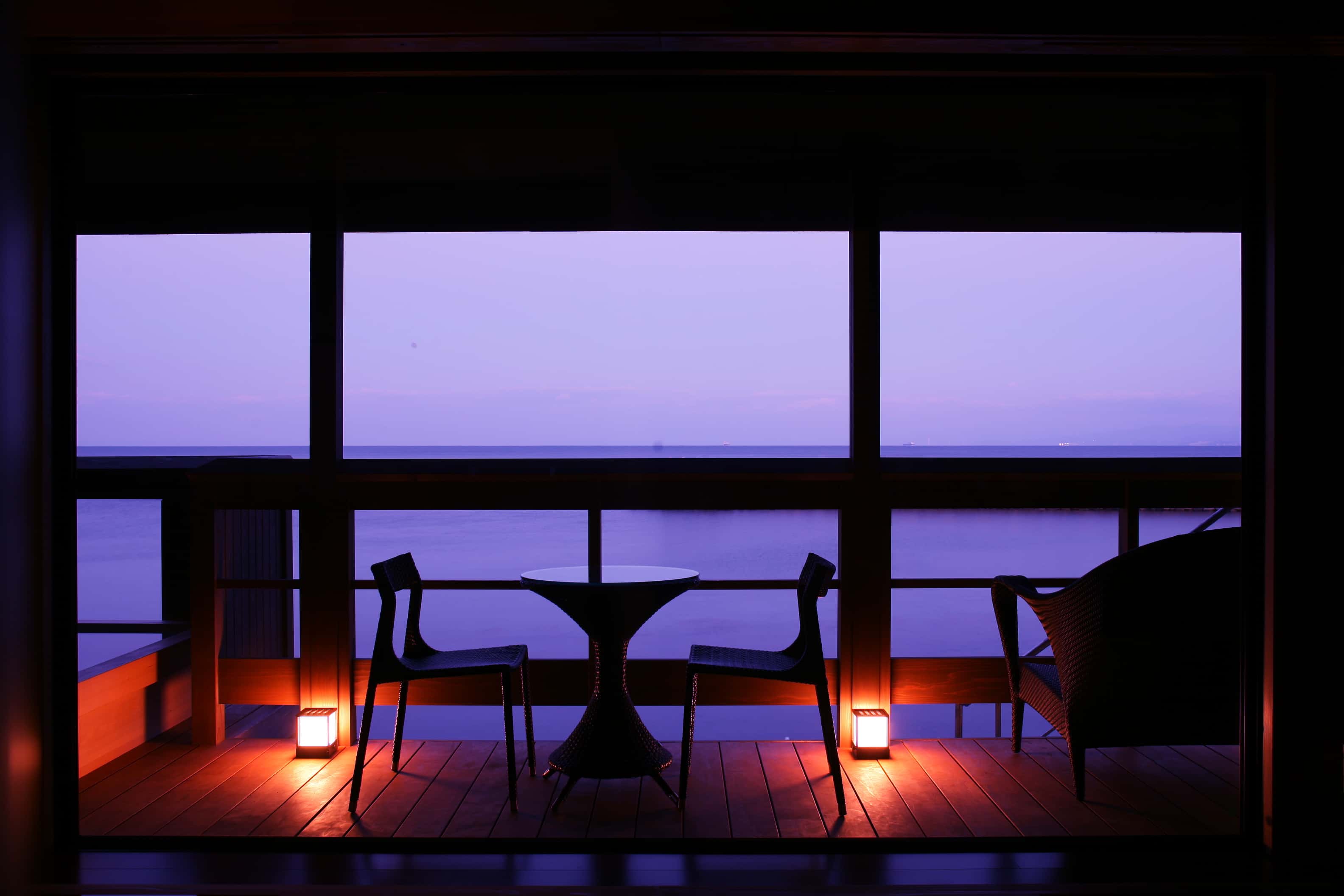 Private balcony seating with ocean sunset view from guest room at Hotel New Awaji, Awaji Island Japan