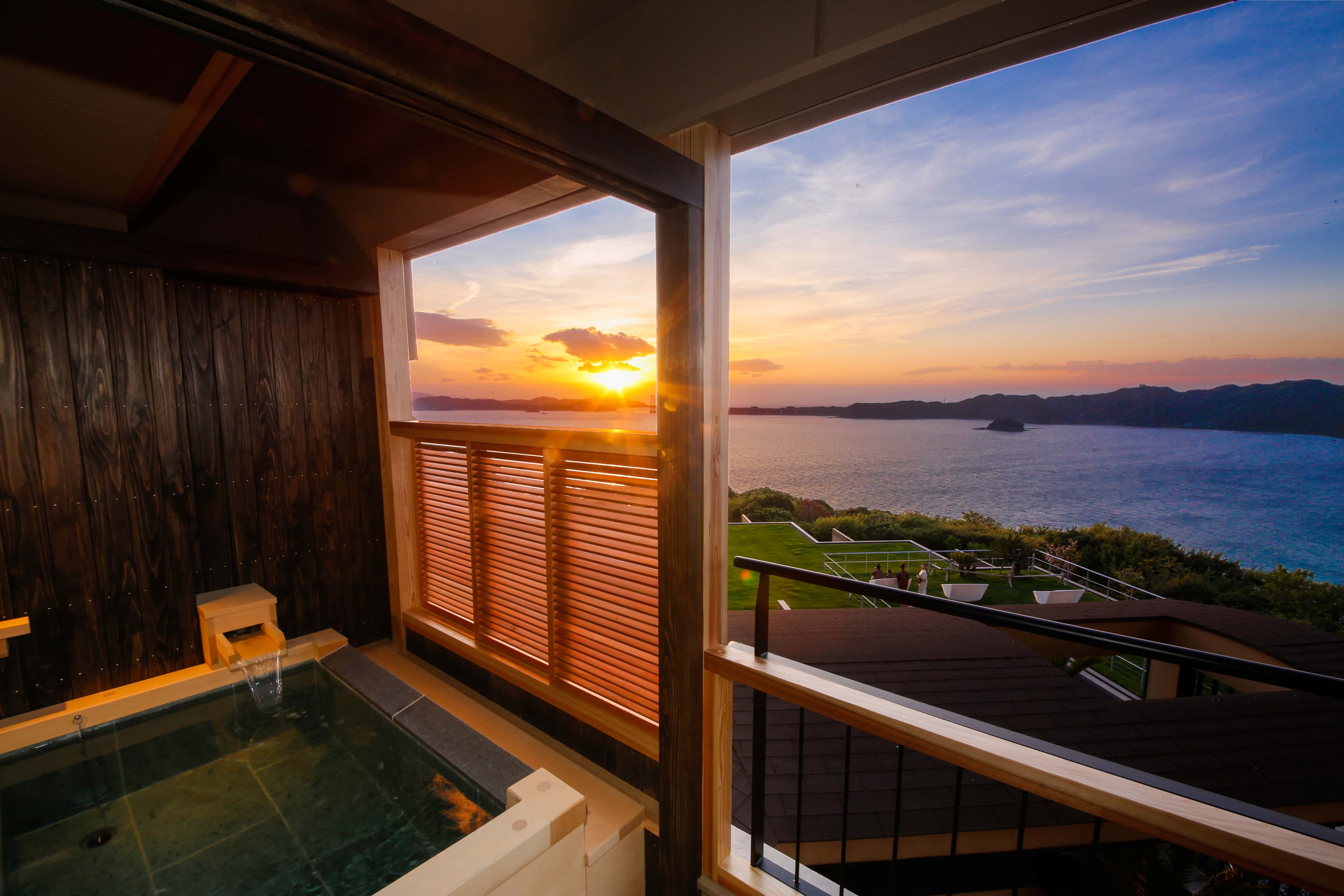 Private balcony onsen bath with sunset ocean view, luxury guest room hot spring experience on Awaji Island