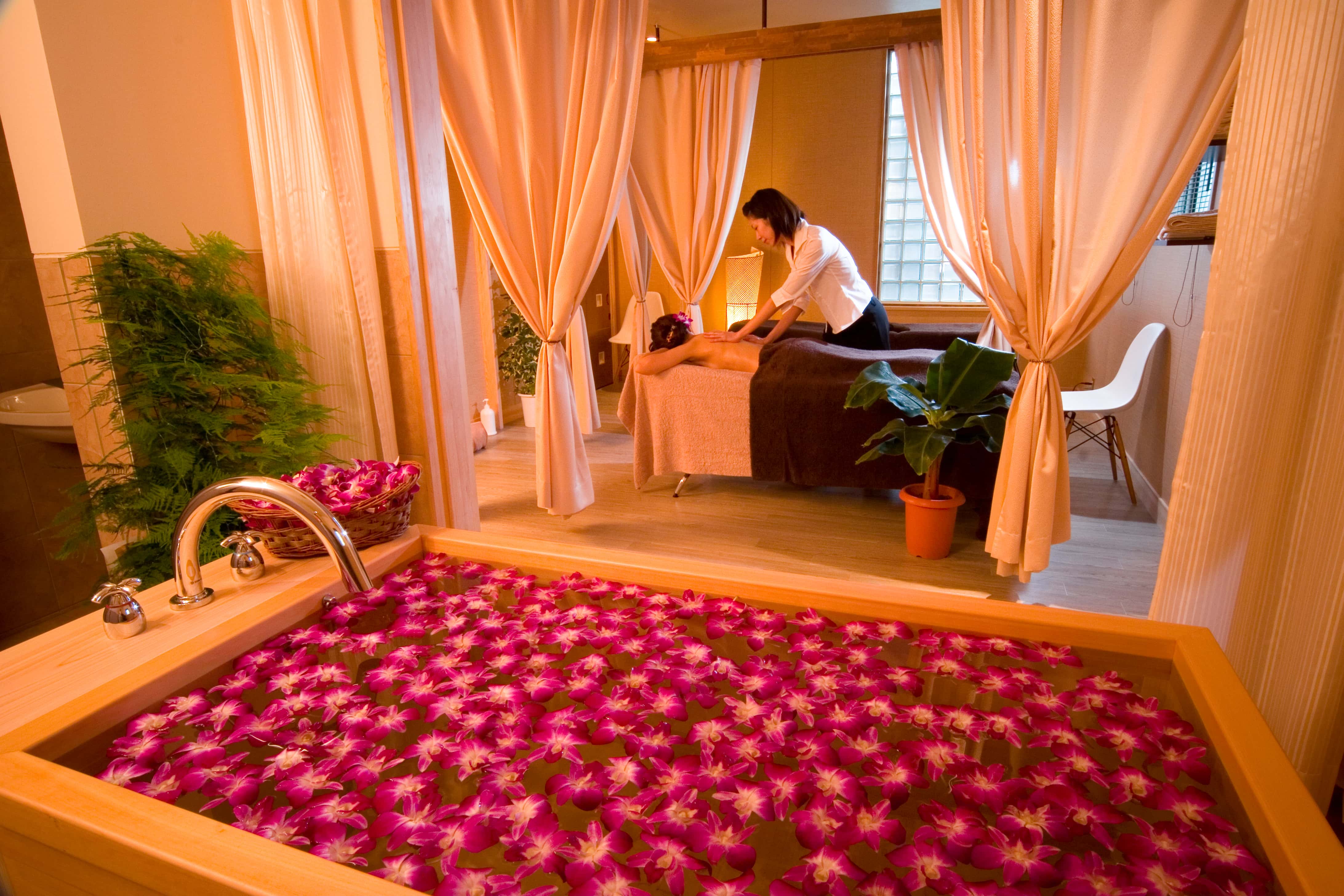 Spa suite with flower bath and private treatment area, Japanese relaxation and wellness experience