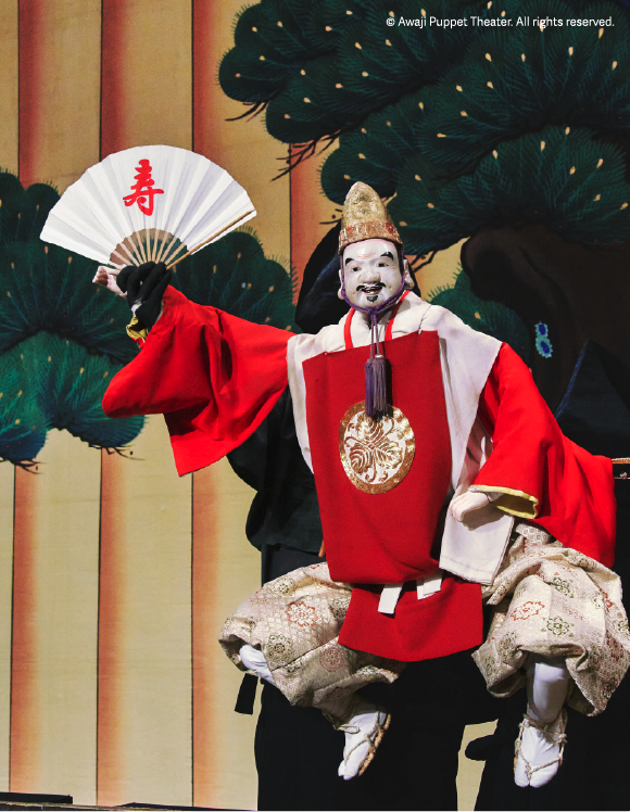 Traditional Awaji puppet theater performance with ornate costume and fan, reflecting cultural heritage and live entertainment