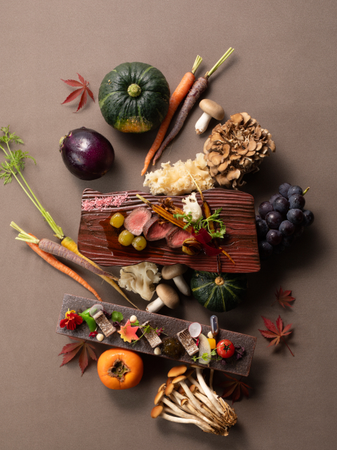 Seasonal Japanese ingredients including wagyu, autumn vegetables, and mushrooms arranged as an overhead flat lay, reflecting the quality and care behind the culinary program at Kobe Bay Sheraton