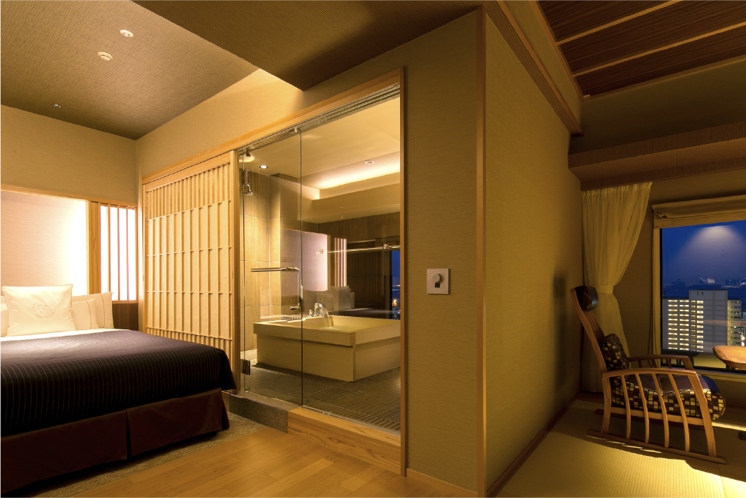 Club Japanese Suite at Hotel New Awaji Group's Lake Biwa property with warm wood ceiling, twin beds, and a garden-facing window, where refined comfort and lakeside scenery unfold from dawn to dusk