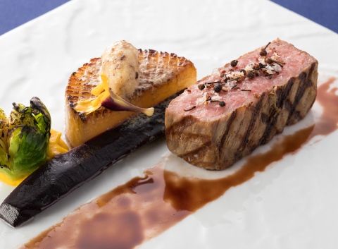 Elegantly plated Kobe Wagyu and seasonal seafood on fine porcelain, showcasing the refined culinary identity that sets Kobe dining apart