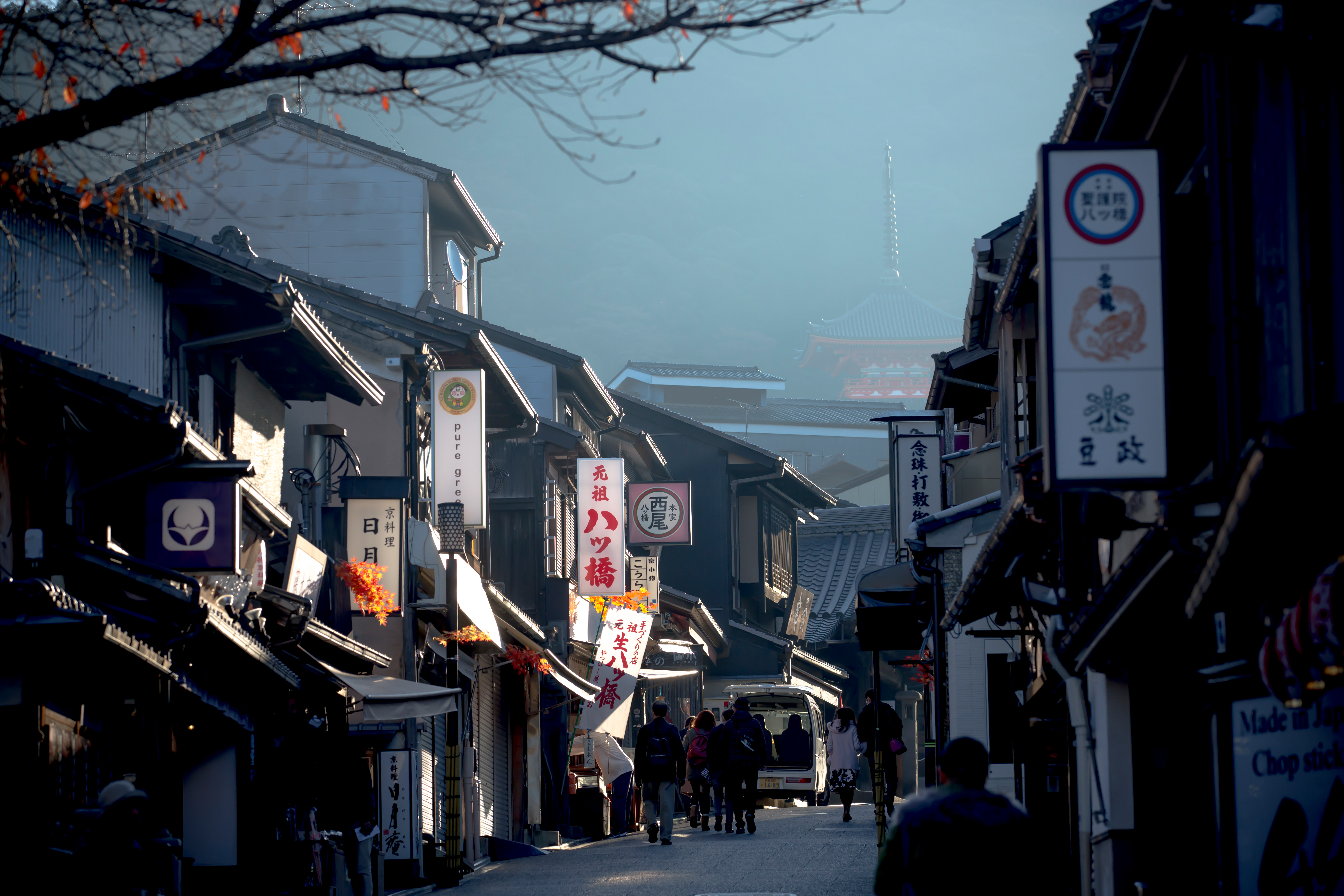 Omihachiman Old Town merchant street lined with Edo-period shopfronts and local signage, preserving the living character of historic lakeside Japan