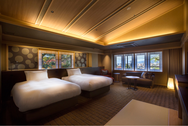 Japanese style twin room with open-air Aoi stone bath at Hotel Yuraku Kyo-yutaki, combining traditional room design with a natural stone bathing experience unique to Kyoto