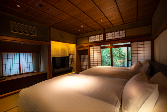 Roku guest room in the Narutaki Main Building at Hotel Yuraku Kyo-yutaki, a spacious Japanese-style retreat with shoji screens and garden-facing windows