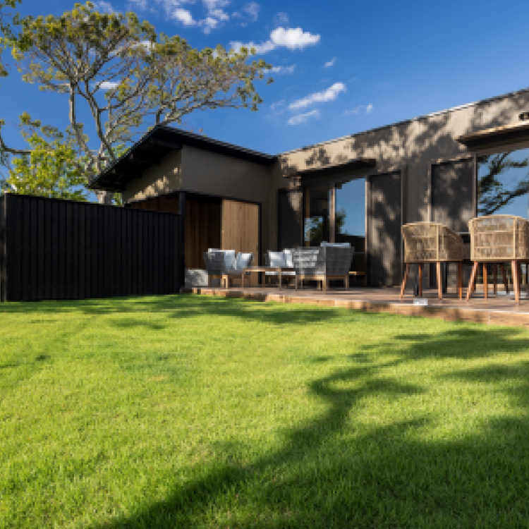 Pet-friendly villa exterior with spacious private lawn and outdoor terrace seating at Hotel New Awaji Lake Biwa