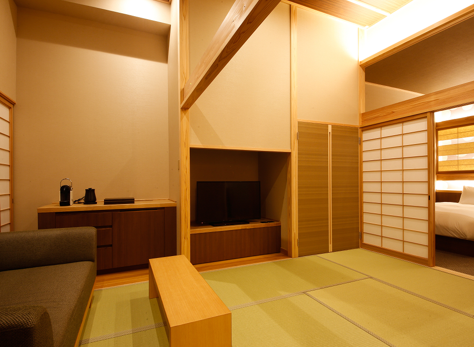 Asan Kotonami tatami room with minimalist design and soft lighting, offering a peaceful and nature-immersed stay in Kagawa