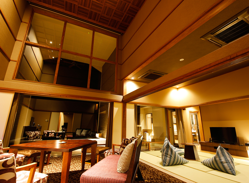 Awaji Hamarikyu interior lounge with wooden beams and ocean views, creating a tranquil and refined resort atmosphere