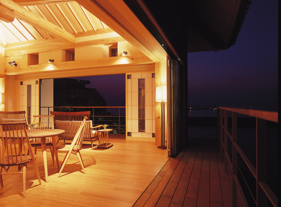 Yumesenkei open-air terrace overlooking the ocean at night, highlighting a peaceful and elevated coastal retreat