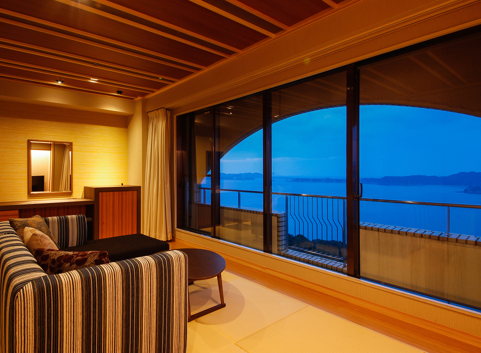 Hotel New Awaji Plaza Awajishima room with large ocean-facing windows, showcasing expansive sea views and comfort