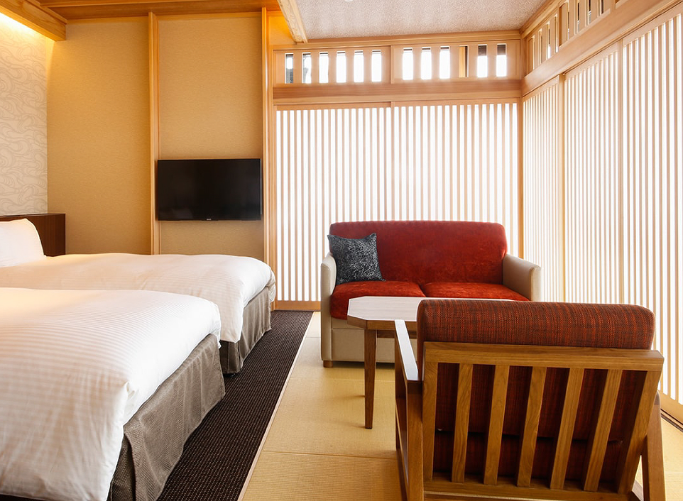 Minato Koyado Umi no Kaori to Awajishima guest room with Western-style beds and warm interiors, providing a comfortable and contemporary stay