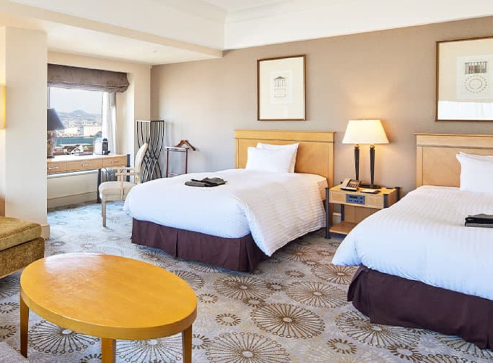 Sheraton Kobe Bay Hotel & Towers guest room with city and harbor views, offering a modern and convenient Kobe stay