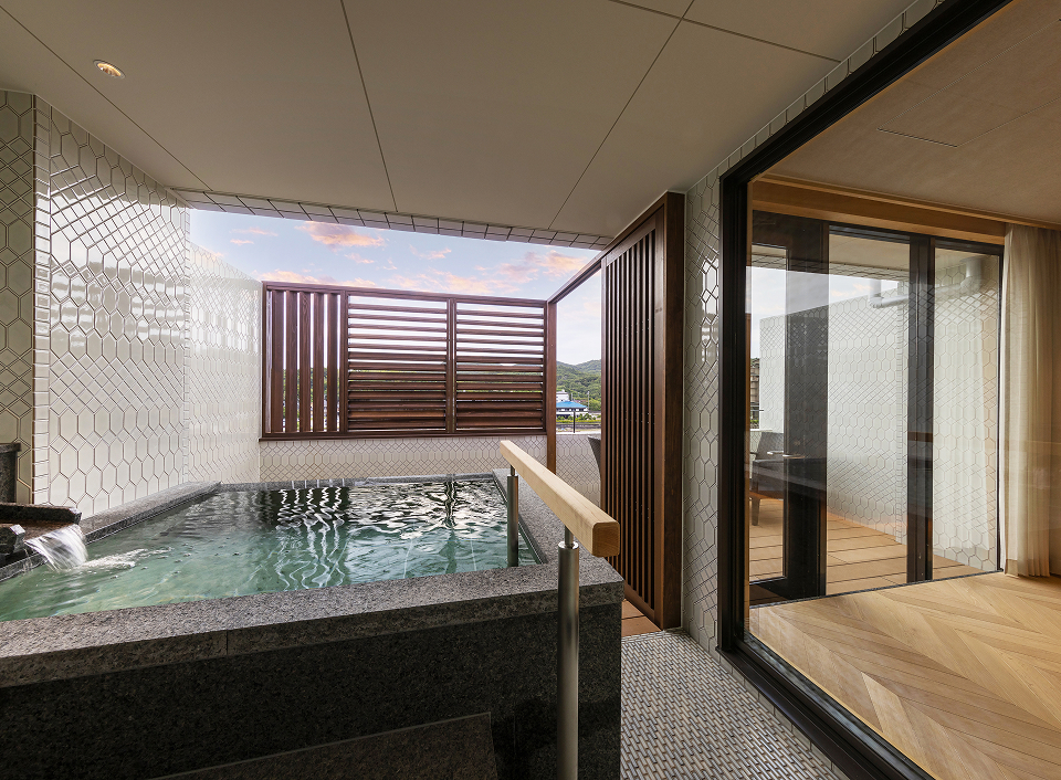 Umi no Hotel Shimahana private onsen bath with outdoor deck, providing a serene and intimate hot spring experience