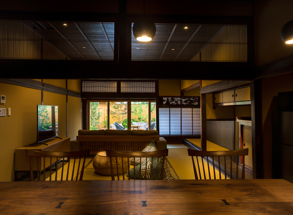 Shiroshita Koyado Kojiya traditional interior with wooden architecture and dining space, providing an intimate and authentic Japanese stay experience