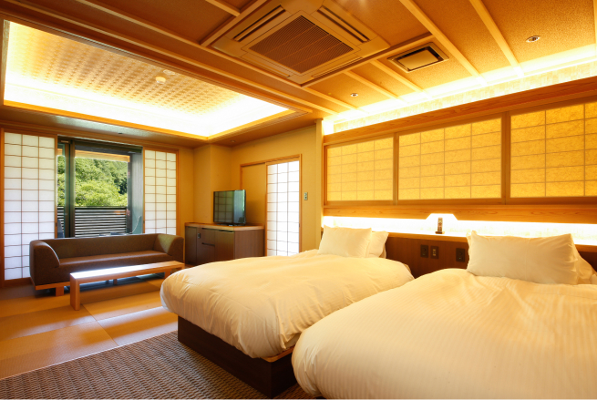 Japanese Western twin room with private open-air bath at Saka-Hotel Kyoto, blending contemporary comfort with an intimate outdoor bathing experience in a Shikoku forest setting