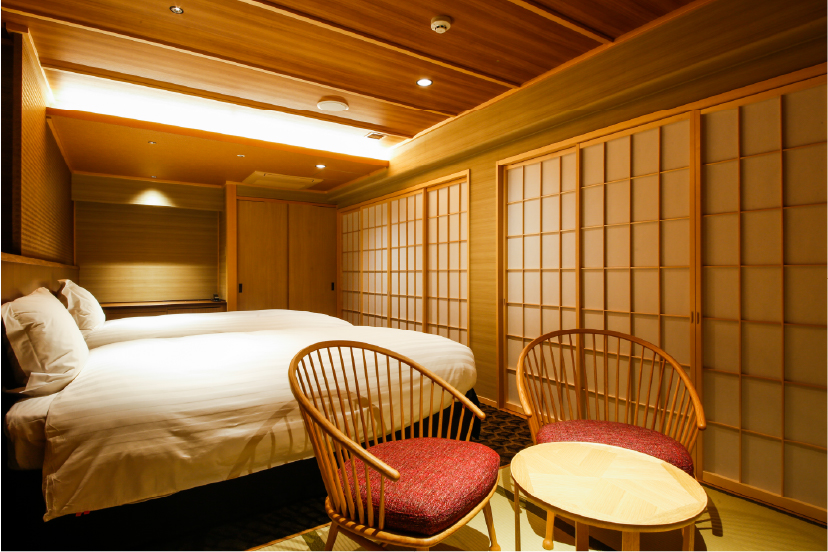 MIYASUMI Comfort Floor Sankyu at Hotel Yuraku Kyo-omishima with shoji-diffused light, woven accent chair, and considered furnishings reflecting the quiet elegance of the property