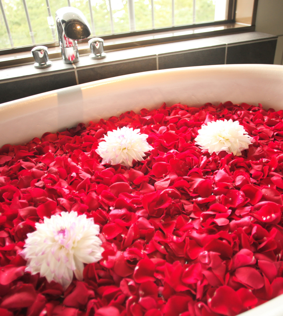 Japanese flower bath with rose petals in onsen spa on Awaji Island in Japan