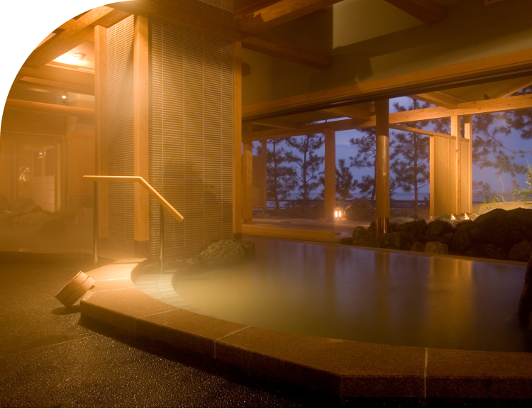Open-air onsen bath at a luxury ryokan on Awaji Island in Japan with relaxing night ambiance